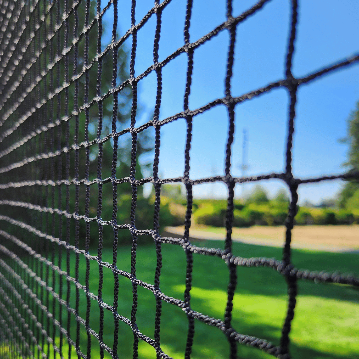 Close up picture of Golf netting on course