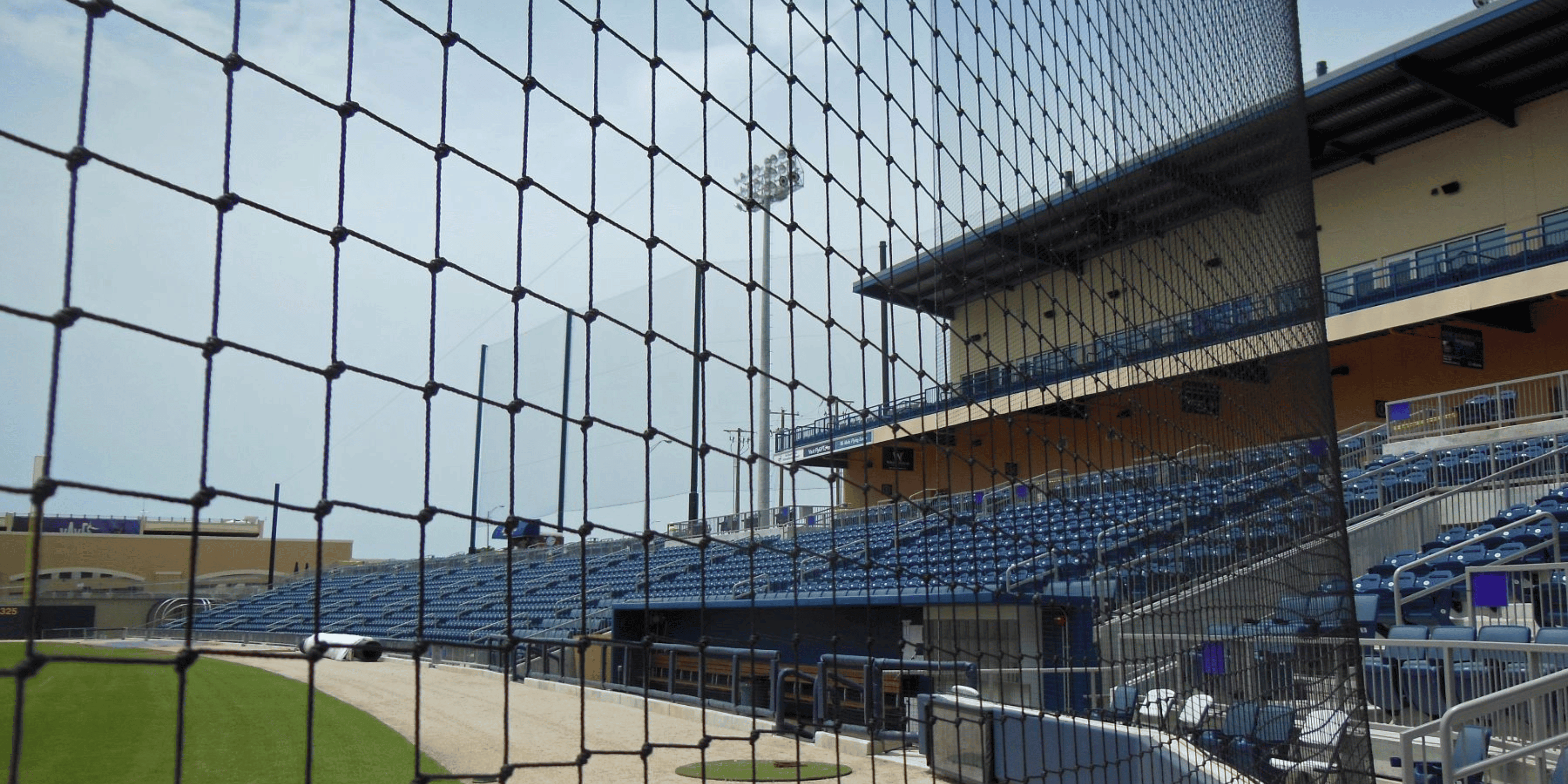 Custom suspended backstop netting up close in baseball stadium