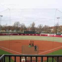 Custom suspended backstop netting to protect fans in the stadium from baseballs and softballs